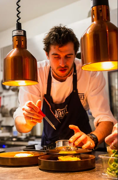 Chef plating a dish