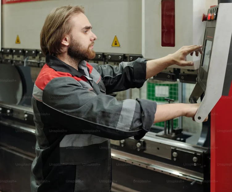 Machine operator at a control panel
