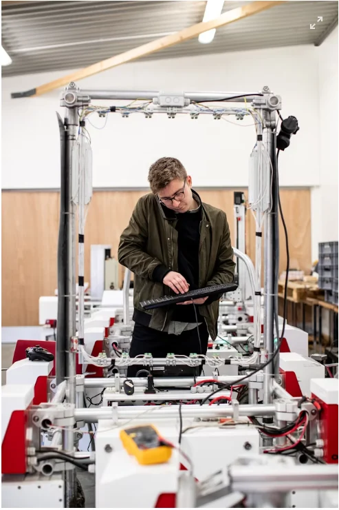 Mechatronics technician testing a machine